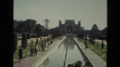 1974: tourists are walking along the shore of the canal before the monument