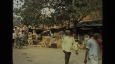 1974: a market area beside a road area is seen INDIA