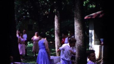 1963: boy dancing a crazy dance to entertain young child COLD SPRINGS, NEW YORK