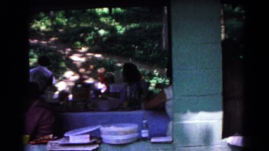 1963: friends and family gather together for a giant meal with barbeque