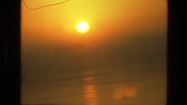 1974: beautiful sunset over water INDIA