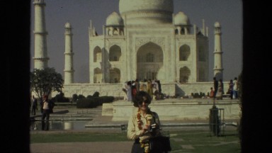 1974: woman wearing sunglasses standing in front of the taj mahal