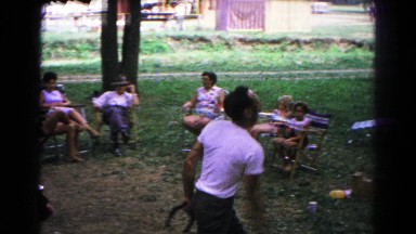1963: man in t-shirt throws horse shoes with onlookers COLD SPRINGS, NEW YORK