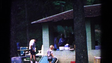 1963: family having fun and dad taking care of the kid near him COLD SPRINGS