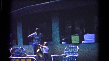 1963: vintage clip of boy trying to put a hat on his head