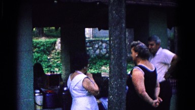 1963: three adults have gathered at an outside venue to socialize
