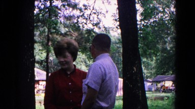 1963: lovers sneaking off get caught embarrassed at summer forested park