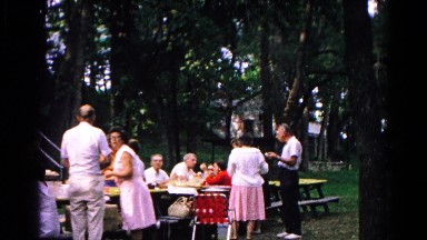 1963: buffet party is going on in the front yard of a house COLD SPRINGS