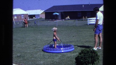 1975: A Child Dipping in a Pool in California