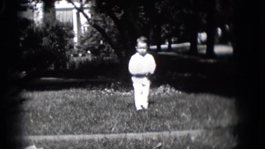 1948: boy enjoying the outdoor play with fun and joy