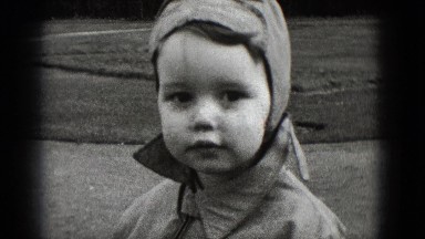 1948: expressions of a child on a beautiful sunny day featuring a big smile