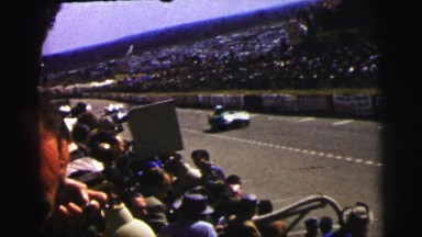1955: Large Crowd Watching Special Vehicles Moving Along the Road Le Mans