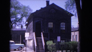 1964: a charming two story home with a car parked outside EVANSTON, ILLINOIS