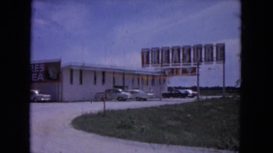 1964: big shop with large display boards near to a road EVANSTON, ILLINOIS