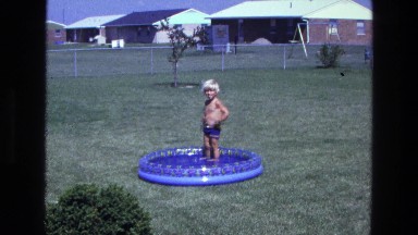 1975: A Child Playing in a Sunny California Garden