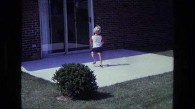 1975: a kid is seen opening a door CALIFORNIA