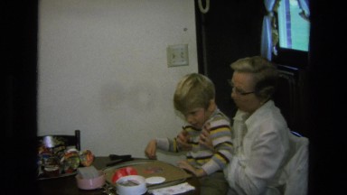 1975: mother helping the boy to complete a diagram on the board CALIFORNIA