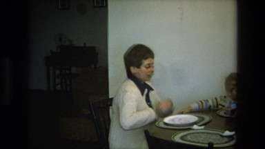 1975: two women and a small boy gathered at the dining room table CALIFORNIA