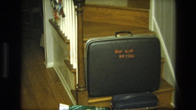 1975: suitcase home again december trip lettering CALIFORNIA