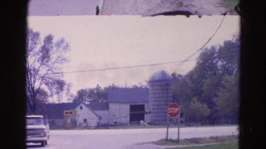 1968: traffic at dead end intersection at stop sign in front of a barn WAUCONDA