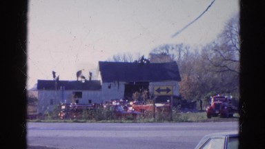 1968: people standing on the roof of a home WAUCONDA, ILLINOIS