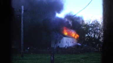 1968: a house is seen destroyed with fire WAUCONDA, ILLINOIS