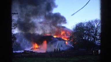 1968: firemen attempt to put out a large house fire with a water hose. WAUCONDA