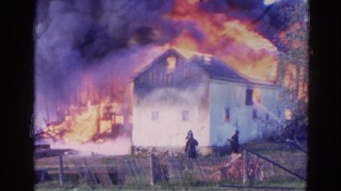 1968: a house is seen destroyed with fire WAUCONDA, ILLINOIS
