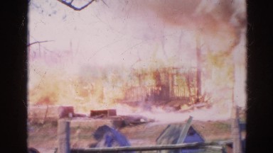 1968: a house engulfed in red hot flames and dark smoke as it burns WAUCONDA,