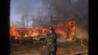 1968: inferno engulf home and surrounding area while firefighters work
