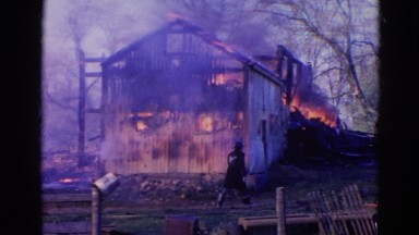 1968: wooden cabin under heavy fire among the dried trees WAUCONDA, ILLINOIS