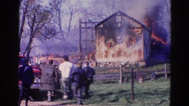 1968: a house is seen destroyed with fire WAUCONDA, ILLINOIS