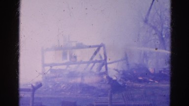1968: a house engulfed in red hot flames and dark smoke as it burns WAUCONDA