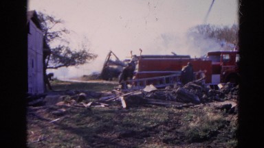 1968: Firefighters Inspecting Fire-Damaged Home in Wauconda, Illinois