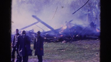 1968: a house engulfed in red hot flames and dark smoke as it burns WAUCONDA