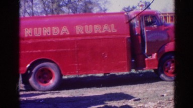 1968: red truck passing through to help the firefighters with a man chasing it