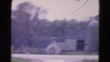 1968: old fashioned hose near to a road where cars moving WAUCONDA, ILLINOIS