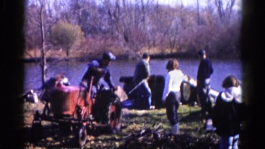 1962: men using a red tractor to pull a boat from the water's edge CHICAGOLAND
