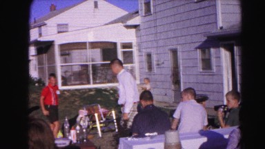 1962: men in plaid pants family gathering kids playing outdoors
