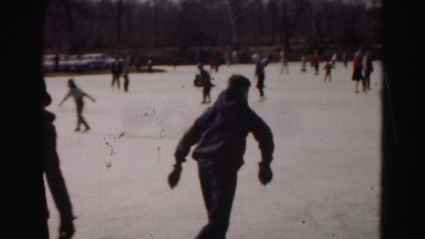 1962: various people ice skating on a frozen pond in winter HAGERSTOWN, MARYLAND