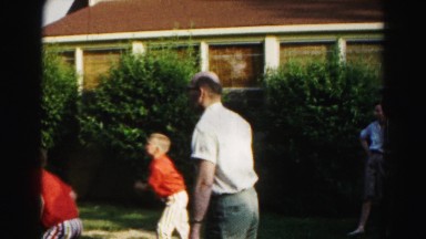 1962: a father is seen playing with children HAGERSTOWN, MARYLAND