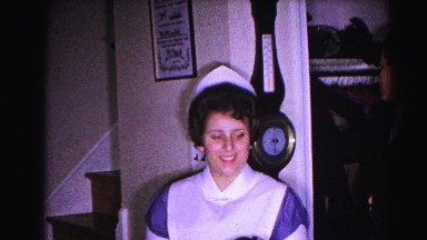 1962: nurse playfully helps boy put away his hat HAGERSTOWN, MARYLAND