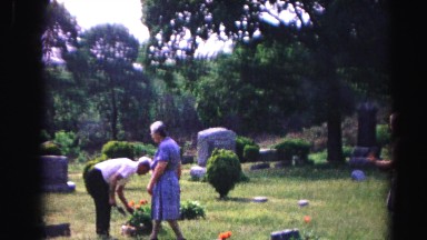 1962: a family gathers on a peaceful cemetery to bring flowers