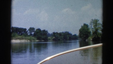 1962: A Boat Approaching a Waterway Pathway in Chicagoland Area