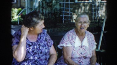 1962: two older ladies swinging in antique swing CHICAGOLAND AREA
