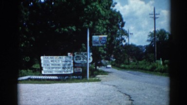 1962: a road is seen having flags along CHICAGOLAND AREA