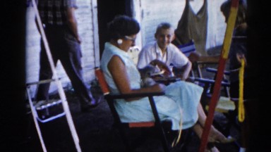 1962: women sitting with a puppy on the lap caressed by a kid CHICAGOLAND AREA
