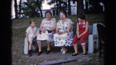 1962: old women and children sitting at rural bus stop CHICAGOLAND AREA