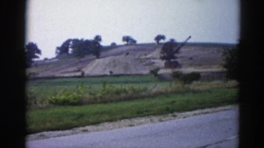 1962: a hill with a green field in the foreground CHICAGOLAND AREA