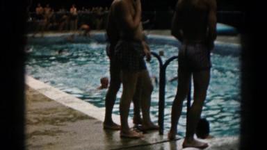 1966: Various Teenagers and Children Enjoying a Swim in a Large Swimming Pool